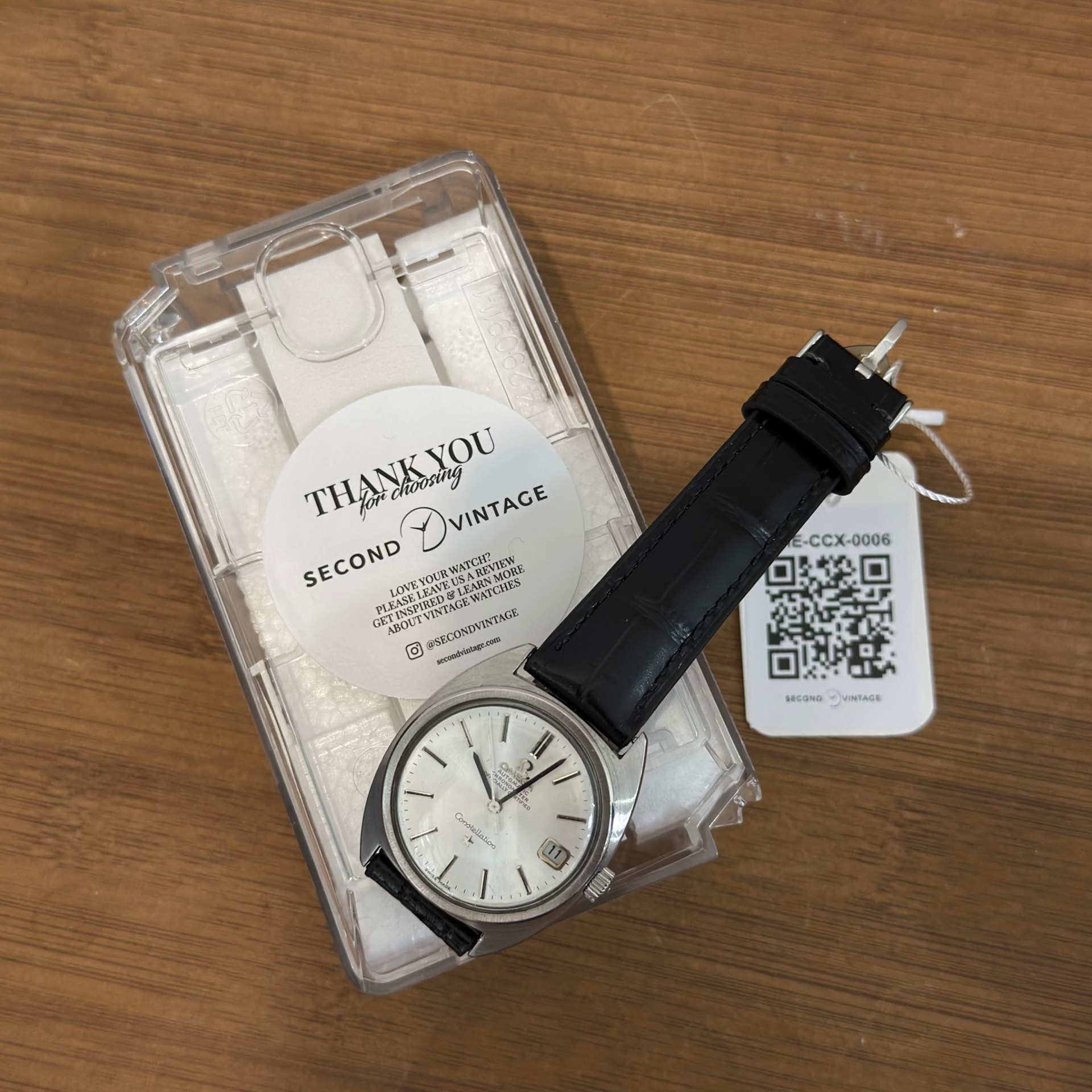 Omega Constellation with a spare leather strap and Second Vintage QR tag