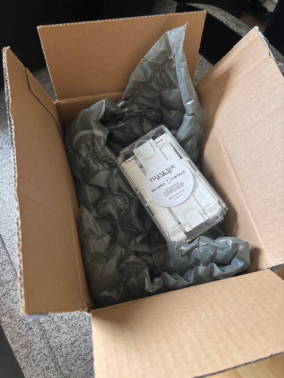 Second Vintage parcel opened, watch case protected inside padded packaging