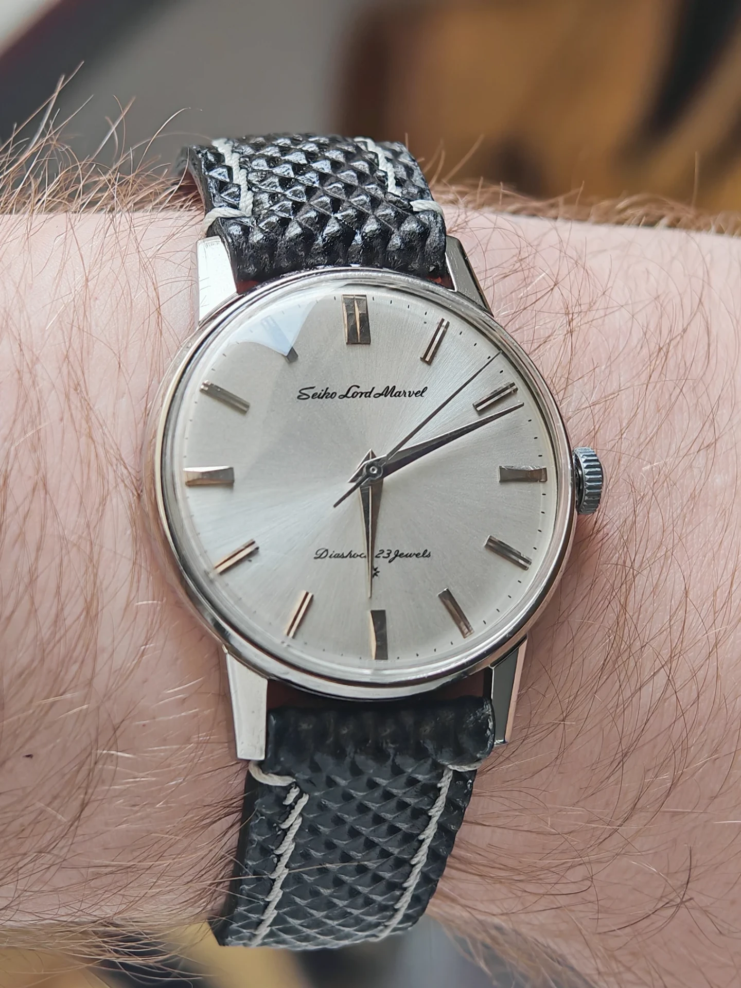 Vintage Seiko Lord Marvel on the wrist of a buyer, on a textured leather strap