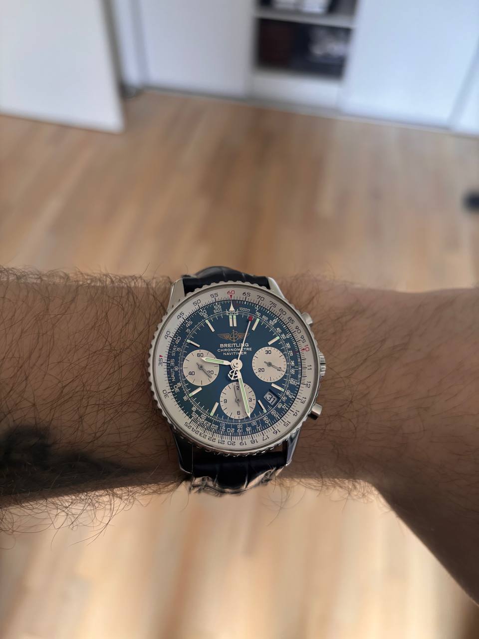 Buyer wearing a vintage Breitling Navitimer chronograph on the wrist