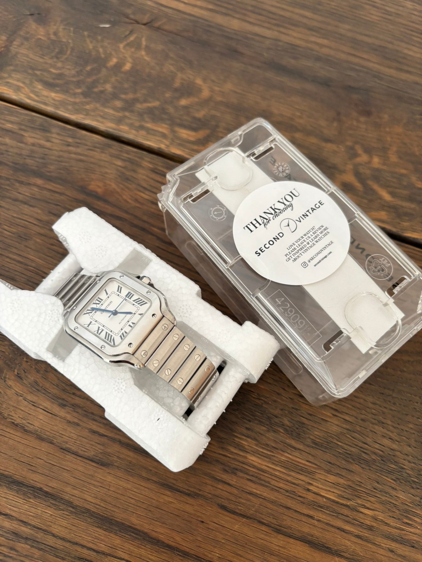 Cartier Santos delivered in protective foam next to the Second Vintage case